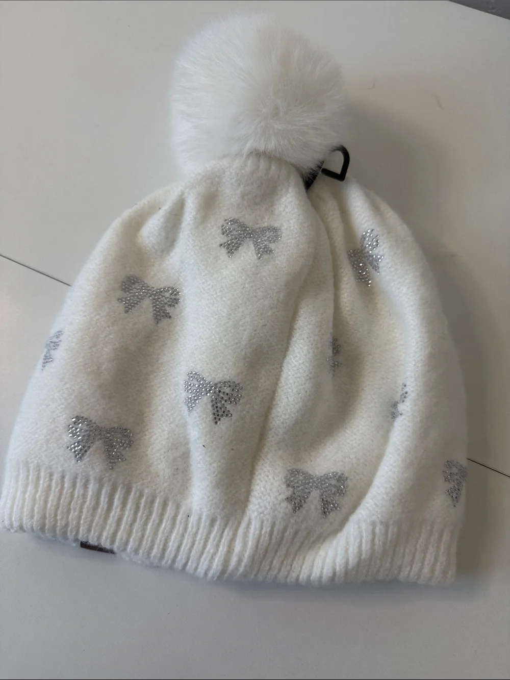 C.C Cream Beanie with Sparkling Silver Bows and Faux Fur Pom